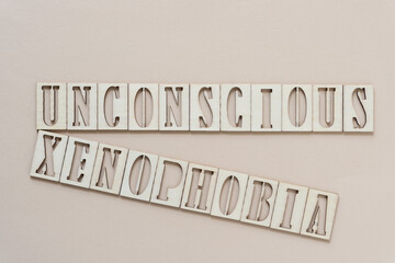 Poster - unconscious xenophobia - sign with wood type