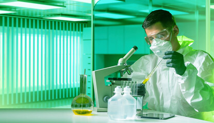 Poster - laboratory technician. man in chemical protection suits. laboratory technician works with hazardous 