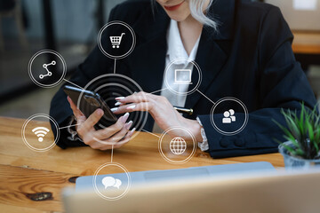 Businesswomen working with smart phone and laptop and digital tablet computer in office with digital marketing media in virtual icon.