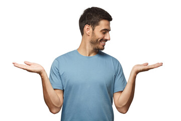 Wall Mural - young handsome male choosing between two different options, holding 2 hands, isolated on gray backgr