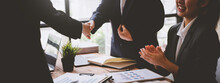 Business Handshake For The Teamwork Of Business Merger And Acquisition, Successfully Negotiate, Two Businessmen Shake Hands With A Partner To Celebration Partnership And Business Deal Concept.