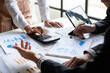 © crizzystudio - Meeting concept Business team hands at working with financial plan, meeting, discussion, brainstorm with tablet on the office desk