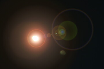 blur full moon cover by spreading cloud with light flare in night