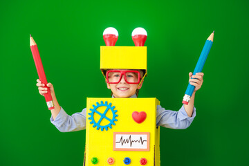 Canvas Print - Happy child wearing a robot