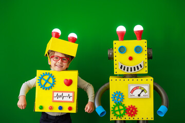 Canvas Print - Happy child with a robot