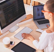 © shefkate - Young woman working in office, sitting at desk