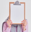 © shefkate - Woman showing a blank page of clipboard