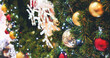© aFotostock - Colourful glittering baubles ornament ball decorated christmas tree on holiday winter xmas happy new year festival celebration. Red, gold, silver ball on Christmas tree. Merry Christmas happy new year