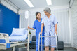 © todja - Asian nurse assisting senior patient trying to walk with saline at hospital, Healthcare and medicine concept.