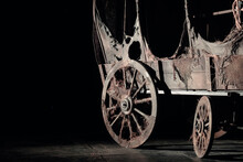 Vintage Wooden Wagon Or Carriage On The Dark Background