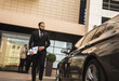 © xartproduction - An Arab man in a suit approaches his car. Business space and promotion. Service and customer service. business lifestyle
