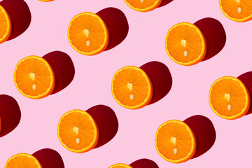 Wall Mural - Orange pattern on a light pink background. Pop art design, creative citruses. Yellow lemon, minimal flat style.