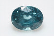 Natural gemstone blue zircon on background