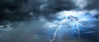 © death_rip - The dark sky with heavy clouds converging and a violent storm before the rain.Bad or moody weather sky and environment. carbon dioxide emissions, greenhouse effect, global warming, climate change.