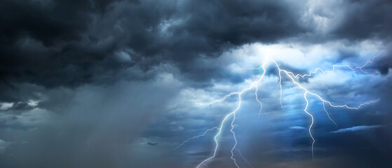 Wall Mural - The dark sky with heavy clouds converging and a violent storm before the rain.Bad or moody weather sky and environment. carbon dioxide emissions, greenhouse effect, global warming, climate change.