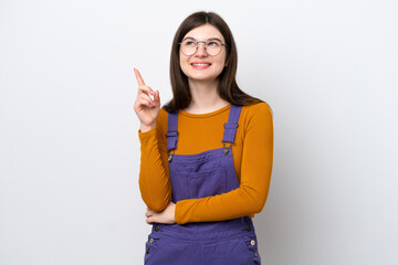 Wall Mural - Young Russian woman isolated on blue background pointing up a great idea