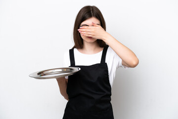 Wall Mural - Young Russian woman chef with tray isolated on white background covering eyes by hands. Do not want to see something