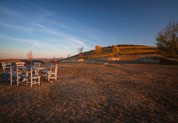 Wall Mural - Table and chairs at the lookout tower of Disznoko in Tokaj region, Hungary in autumn