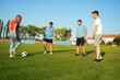 © phoenix021 - Group of people deferent age playing soccer for fun, team building