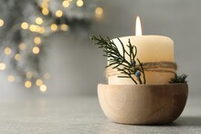 Burning Candle With Pinecone Scent On Light Grey Table, Closeup. Space For Text