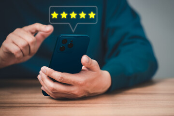 Fototapete - Man using a smartphone in give rating to service experience on application. Online customer review satisfaction feedback survey and testimonial.