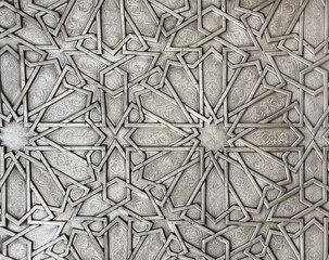 Wall Mural - Detail of metal door with traditional islamic ornament. Copper shutter with antique and national moroccan floral pattern