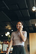 © Jacob Lund - Businesswoman taking a phone call in a co-working space