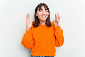 Young caucasian woman isolated on white background laughs out loudly keeping hand on chest.