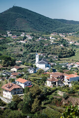 View of the village houses and a church in the hills of the Douro Valley, Porto, Portugal.