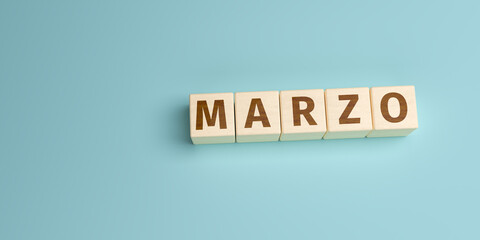 Wall Mural - The Spanish word Marzo (March) built from letters on wooden cubes. High angle view with copy space