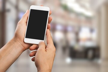 Canvas Print - Human hand hold a phone with a blank screen