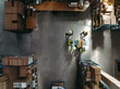 © Jacob Lund - Top view of warehouse workers having a discussion during a meeting