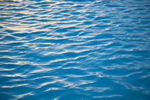 Closeup Seascape Surface Of Blue Sea Water With Small Ripple Waves