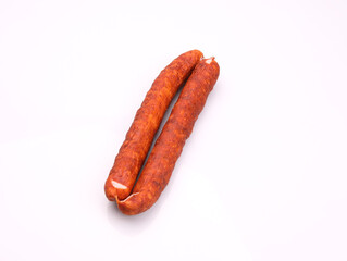 Wall Mural - Traditional smoked pork sausage, long, isolated. Polish meat sausage, a packshot photo for package design.