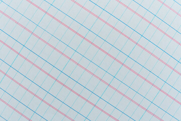 Graph paper texture background with empty grid columns set on an angle with a pattern of red and blue lines on a white background from an accounts notebook, stock photo image