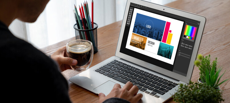 Graphic designer software for modern design of web page and commercial ads showing on the computer screen