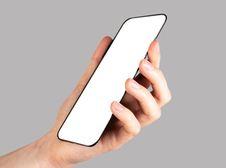 Poster - Hand holding phone mockup on grey background. Angled view. template with white screen. Electronic device.
