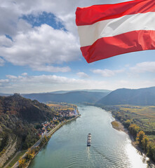 Wall Mural - Panorama of Duernstein village with ship on Danube river during autumn in Austria, UNESCO