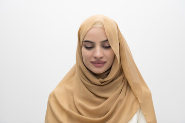 Wall Mural - Portrait of young muslim woman wearing hijab on isolated white background