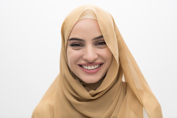 Wall Mural - Portrait of young muslim woman wearing hijab on isolated white background