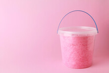 Close Up Sweet Fluffy Pink Color Cotton Candy In Plastic Basket Package On Pink Background. Spun Sugar. Minimal Sweet Concept. Space For Text, Copy Space
