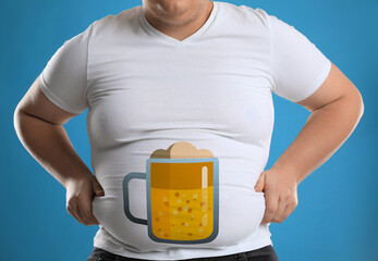 Canvas Print - Beer belly problem. Overweight man on blue background, closeup