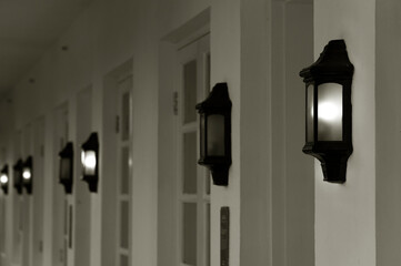Poster - row of vintage lamps light on wall