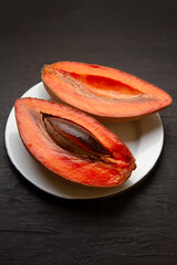 Wall Mural - Mexican fruit called mamey on dark background