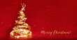 © taniasv - defocused christmas tree from the golden xmas lights on red background. Copy space. Merry Christmas text card. Blurred silhouette