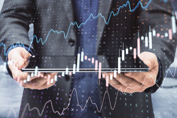 Poster - Close up of businessman hand holding tablet with creative glowing forex chart on blurry office interior background. Trade, finance, stats. Double exposure.