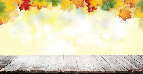 Wall Mural - Wooden table and autumn bokeh background