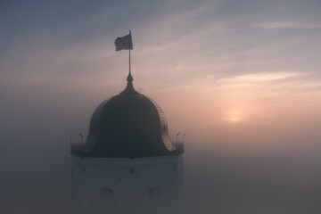 Aerial view of the tower of an ancient castle in Vyborg, Russia. Foggy morning