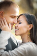 © Roman - Cute romantic young couple hugging tenderly in autumn nature.