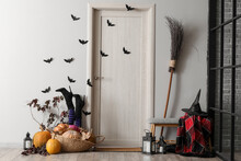 Wooden Door With Paper Bats In Hall Decorated For Halloween